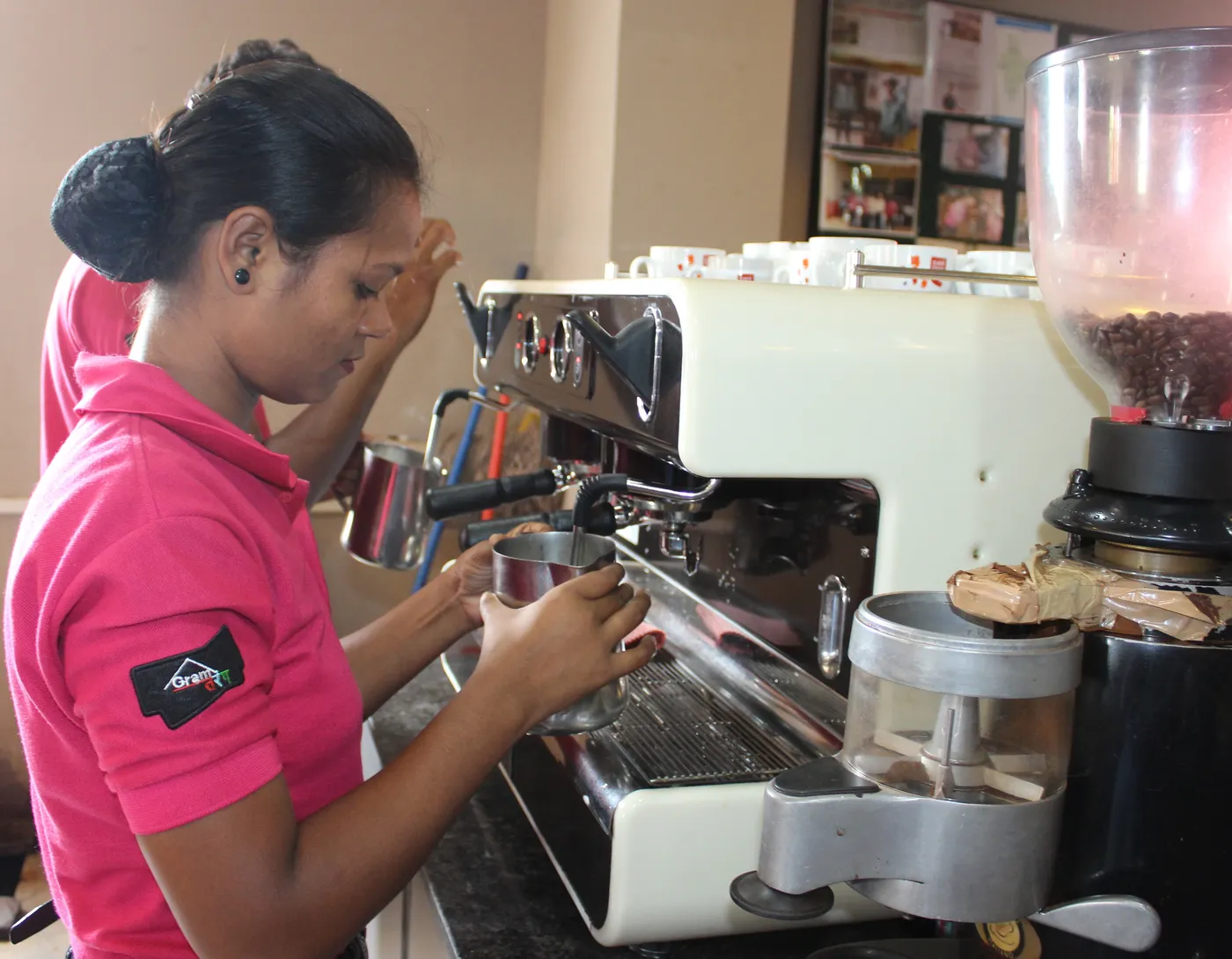 A brewmaster at work on a café espresso bar